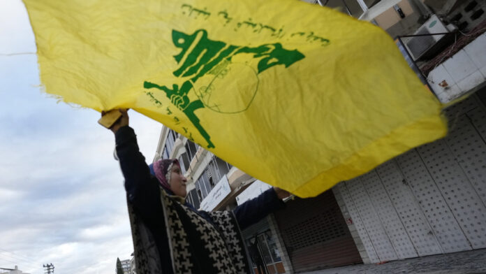 hezbolah_woman_flag_ap24332186848697.jpg
